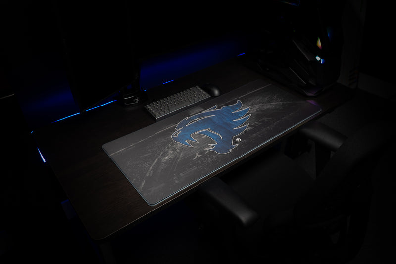 Angled view of the Kentucky Wild Cat's Home Turf deskmat across a gaming desk.