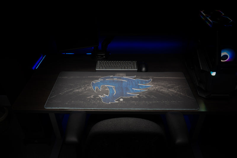 Front view of the Kentucky Wild Cat's Home Turf deskmat in a dark gaming setup.