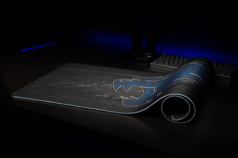Kentucky Wild Cat's Home Turf deskmat partially rolled with blue wildcat logo visible.