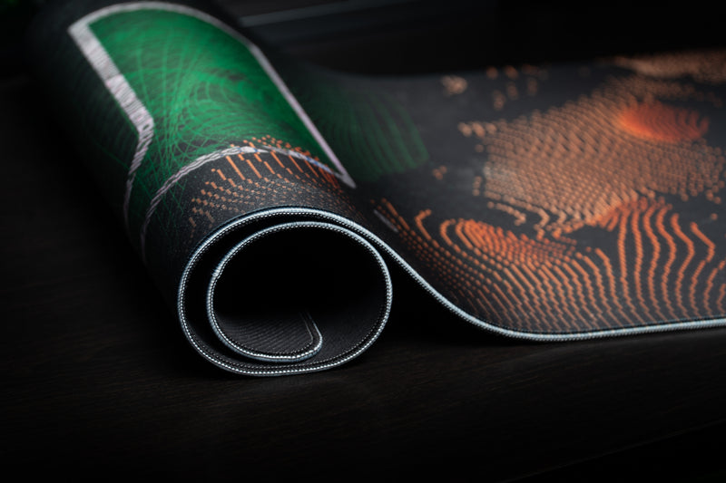 University of Miami Etched Storm deskmat close-up of the green U and rolled stitched edge