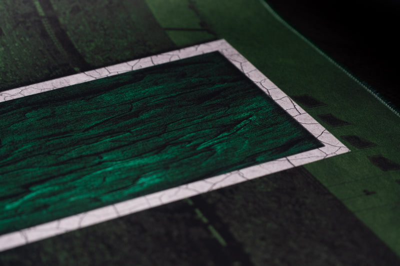 Close-up of the green side of the U and white outline on the University of Miami Home Turf deskmat