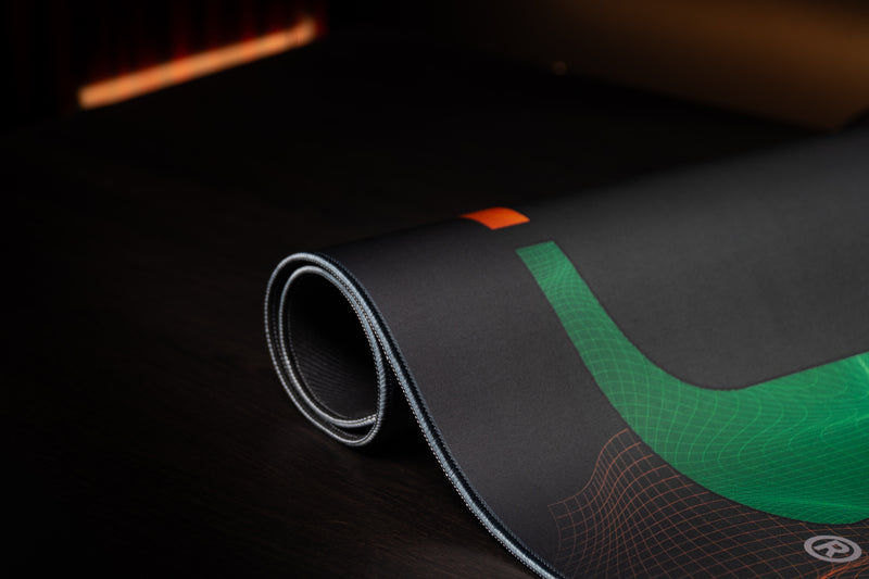 University of Miami Hurricane Flowstate deskmat close-up of the green U and rolled stitched edge