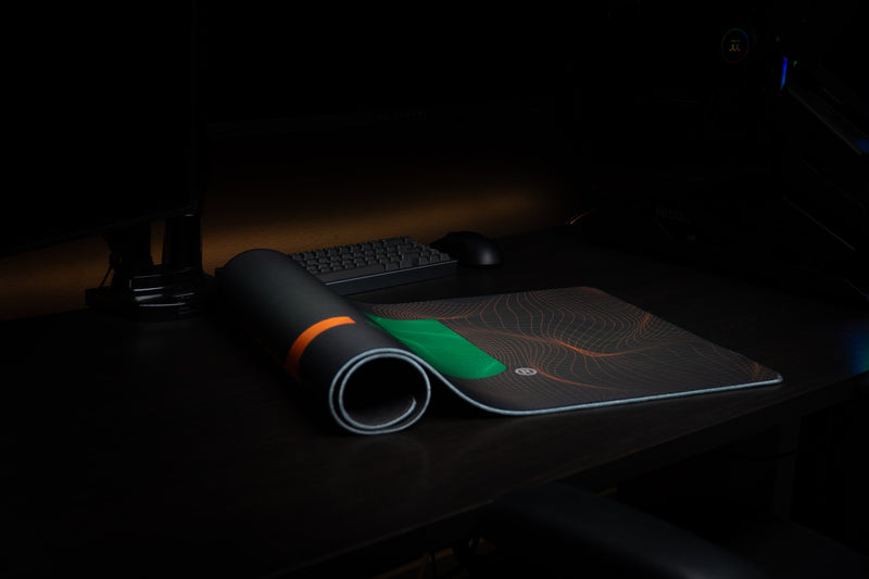 University of Miami Hurricane Flowstate deskmat partially rolled mat showing the flowing wireframe pattern