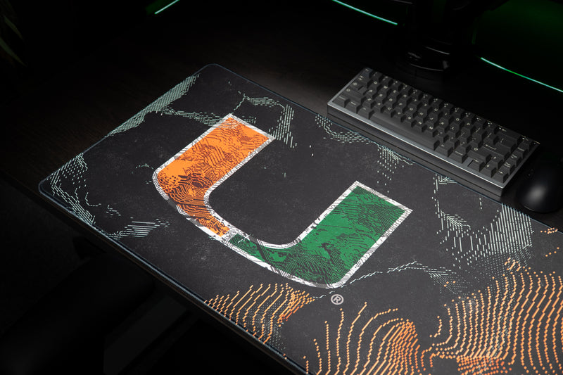 University of Miami Hurricane Static deskmat detail view of the Hurricane Static deskmat in a dark gaming setup