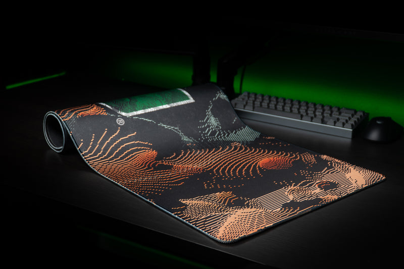 University of Miami Hurricane Static deskmat partially rolled deskmat revealing orange static lines