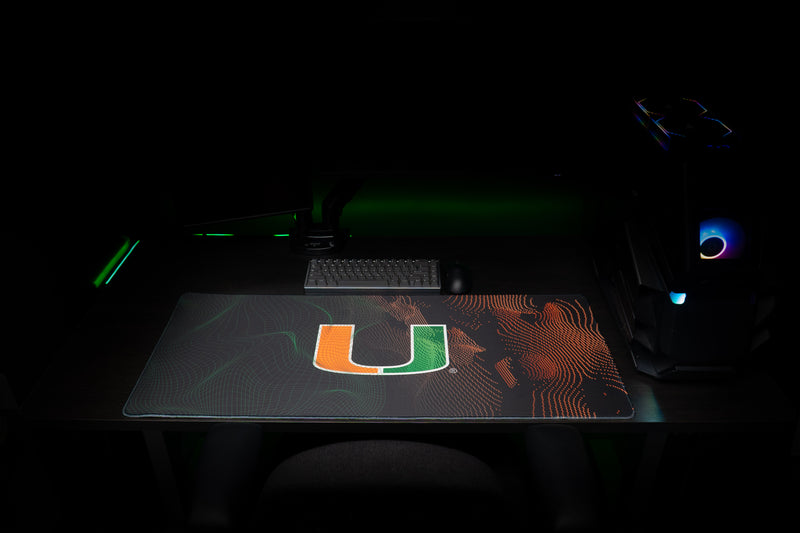 University of Miami Miami Surge deskmat front view of the centered U and flowing green and orange patterns