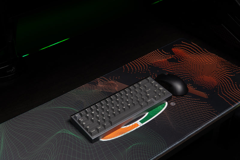 University of Miami Miami Surge deskmat angled view with keyboard and mouse over the U artwork
