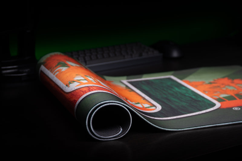 University of Miami Paradise deskmat close-up of the rolled edge near the orange palms and U artwork