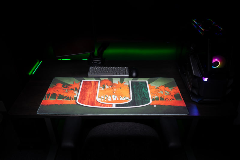 University of Miami Paradise deskmat front view showing the full U, orange palms, and green rays