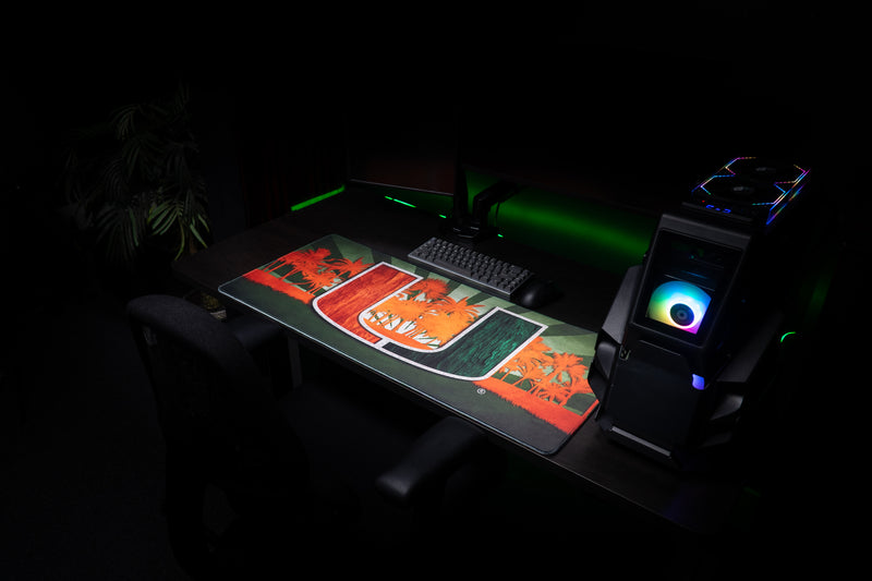 University of Miami Paradise deskmat wide angled view of the Paradise deskmat beside a gaming PC