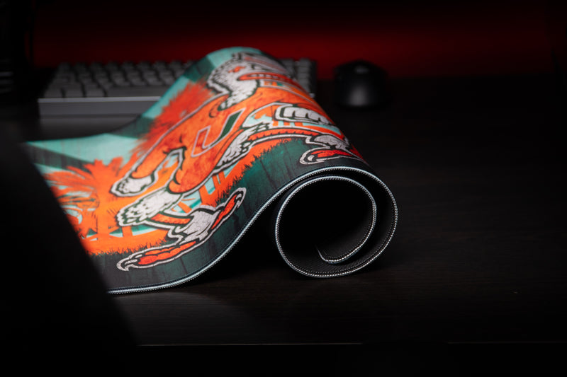 University of Miami Sebastian in Paradise deskmat close-up of Sebastian artwork and the rolled stitched edge