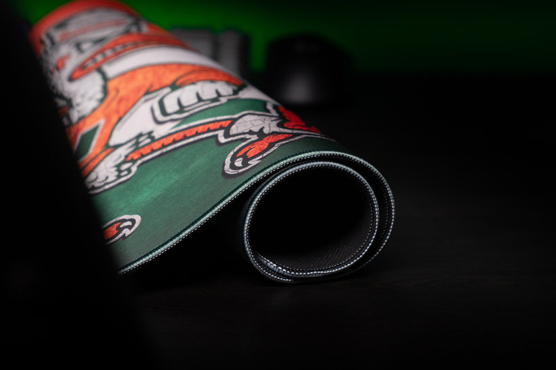 University of Miami Sebastian Pride deskmat close-up of Sebastian's claws on the rolled stitched edge