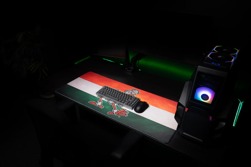 University of Miami Sebastian Pride deskmat angled view with keyboard and mouse on the Sebastian Pride deskmat