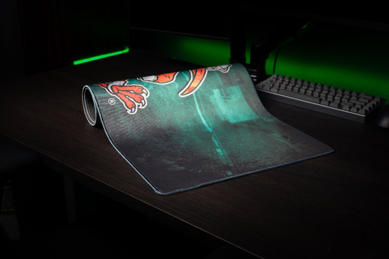 University of Miami Sebastian's Home Turf deskmat partially rolled deskmat revealing Sebastian and stadium artwork