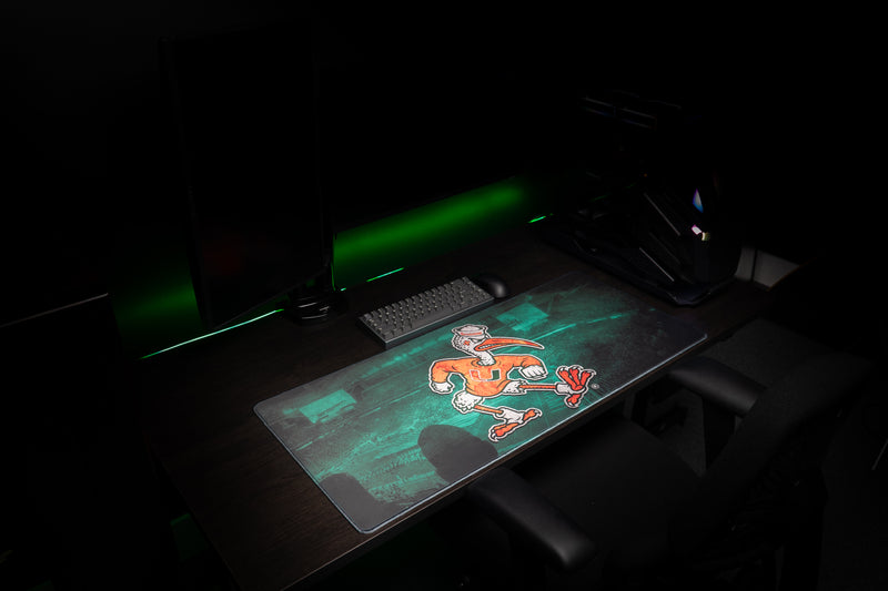 University of Miami Sebastian's Home Turf deskmat wide angled view of the Sebastian stadium deskmat in a gaming setup
