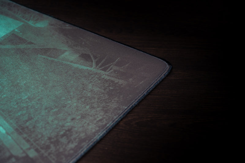 University of Miami Sebastian's Home Turf deskmat close-up of the stitched corner and teal stadium print