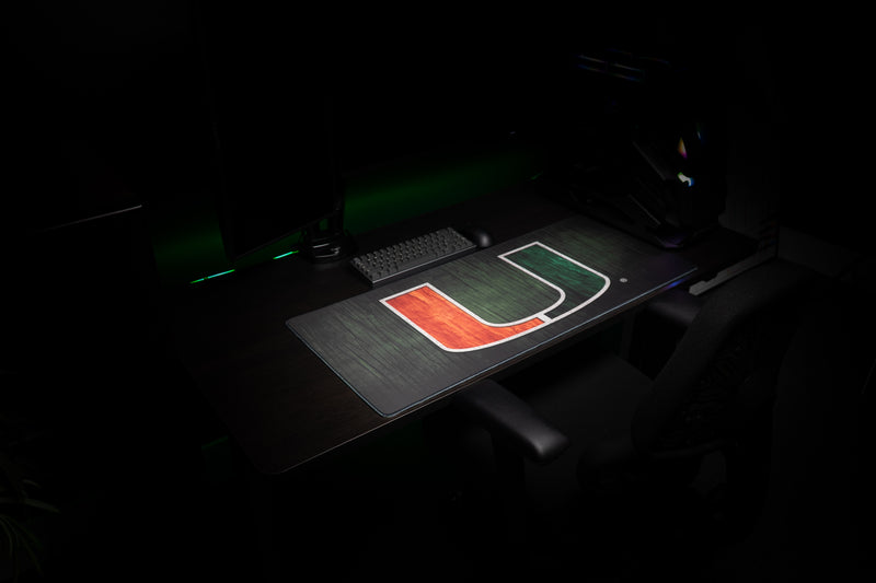 University of Miami The U deskmat wide angled view of the U deskmat in a gaming setup