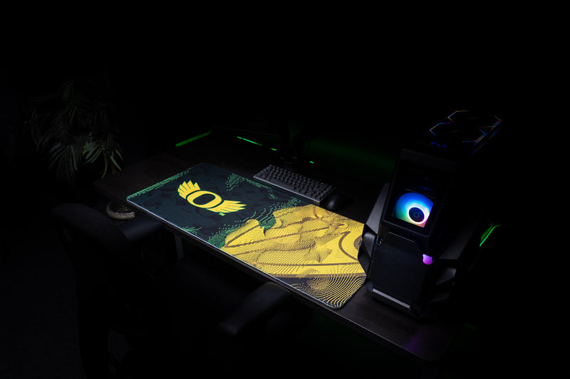 Oregon Emerald Flight deskmat across an angled gaming workstation.