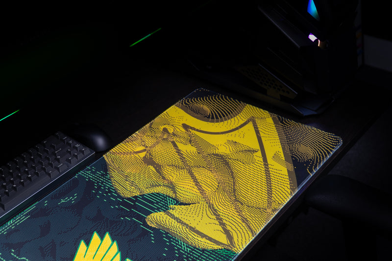 Detail of the gold abstract pattern on the Oregon Emerald Flight deskmat.