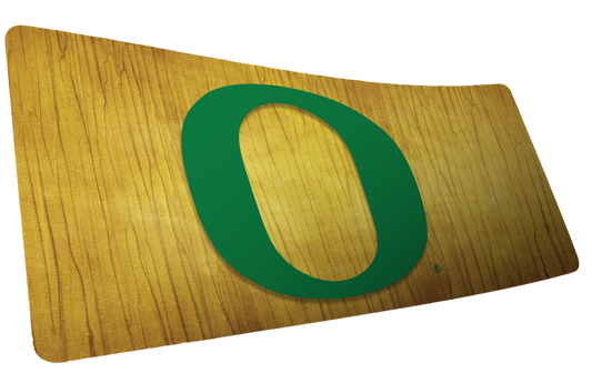 University of Oregon Emerald Grain deskmat with a large green O on a golden wood-grain background.