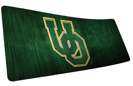 University of Oregon Evergreen deskmat with green-and-yellow UO logo on a dark green wood-grain background.