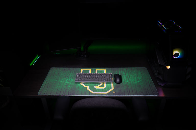 Front view of keyboard and mouse on the Oregon Evergreen deskmat.