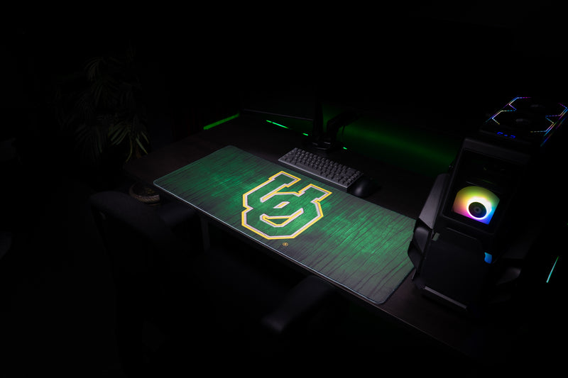 Wide view of the Oregon Evergreen deskmat in a gaming workstation.