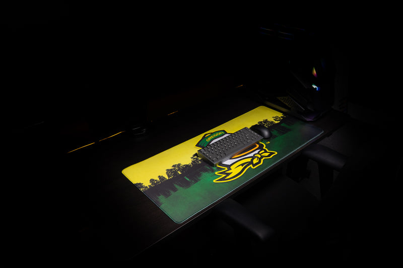 Keyboard and mouse on the Oregon Home of the Ducks deskmat.