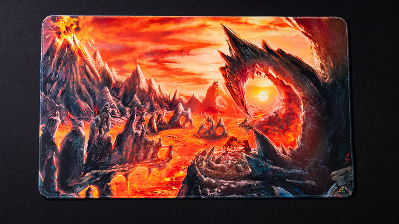 Fantasy lava landscape playmat featuring erupting volcanoes, molten rivers, jagged obsidian formations, glowing magma pools, and a fiery sunset framed by a massive volcanic arch.