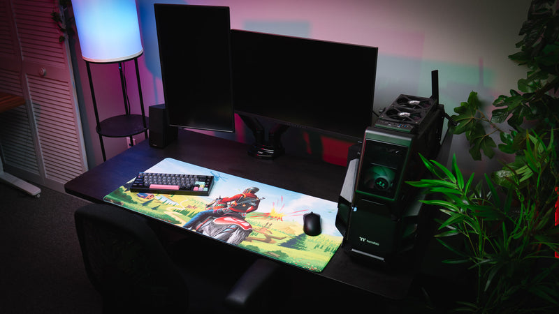 Willy and his Horse gaming deskmat displayed in a complete desktop gaming setup, showcasing the colorful landscape artwork, premium print quality, and extended mousepad size.