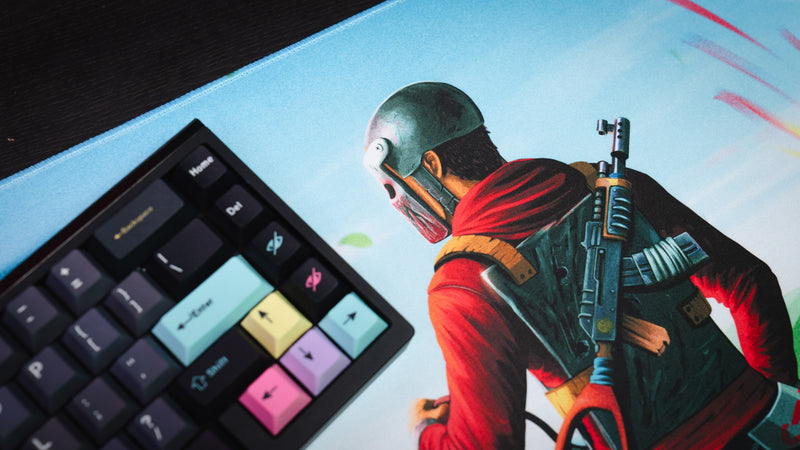 Close-up of the Willy and his Horse gaming deskmat beside a mechanical keyboard, showcasing the detailed rider artwork and premium high-definition print.