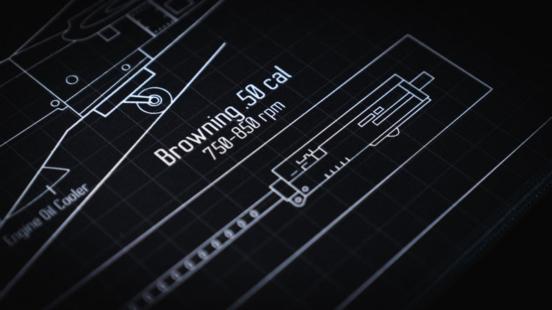 Close-up of the Wings of Liberty P-51D Mustang blueprint deskmat highlighting the Browning .50 caliber weapon diagram, technical annotations, and precision drafting grid.