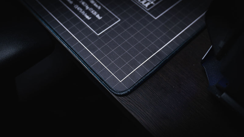 Close-up of the stitched edge and premium fabric surface on the Wings of Liberty P-51D Mustang blueprint deskmat, highlighting durable construction and crisp blueprint printing.