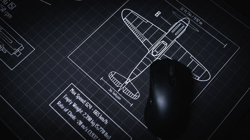 Close-up of the Wings of Steel deskmat featuring the BF 109 G-6 top-view aircraft blueprint with technical specifications, engineering line art, and a gaming mouse on the premium surface.