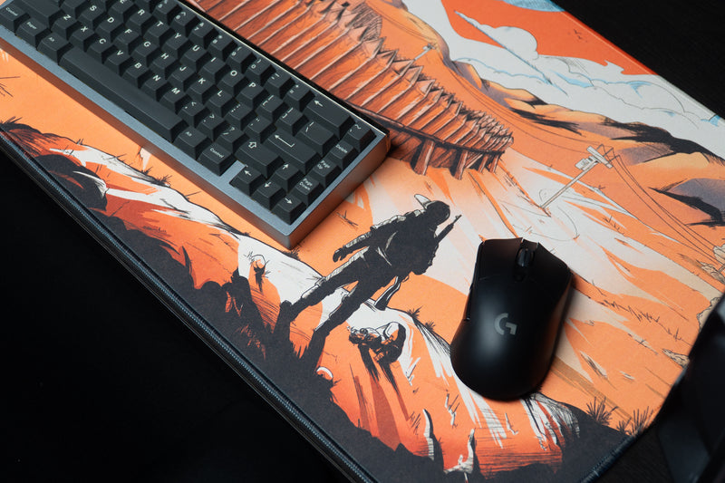 Close-up of Zodec's Great Wall of Chernarus desk mat with a keyboard and gaming mouse on it, showing the survivor art and stitched edge