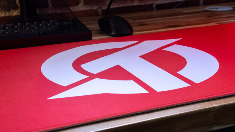 "OT" — Rust Deskmat